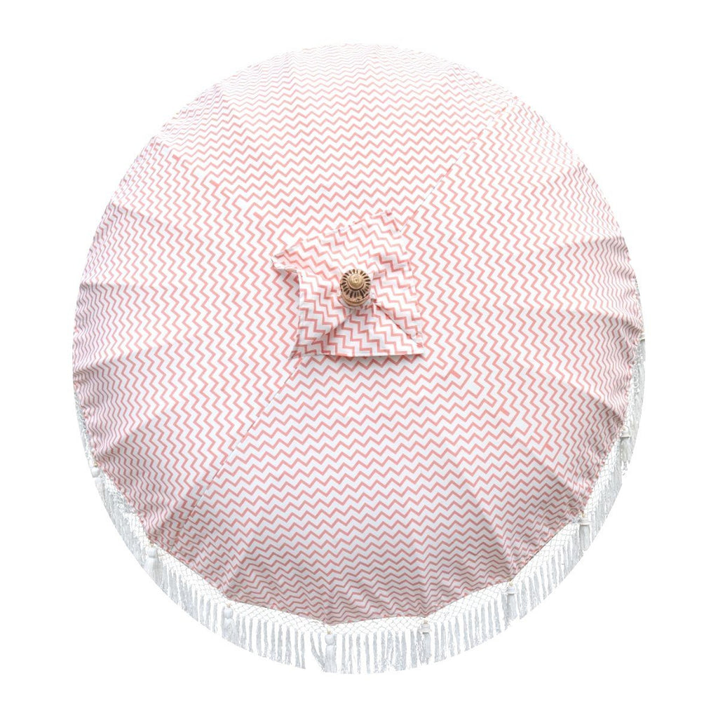 East London Parasol Kate- coral pink zig zag garden parasol with tassels in shades of white, hand made. The perfect garden umbrella for picnics, gardens, summer, patios, pool side and terraces.  Bali and Indian inspired garden parasol and luxurious designer garden feature.