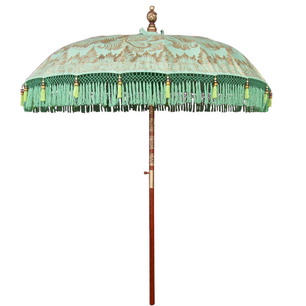 Tracy parasol garden umbrella or parasol for east london parasol company. Handmade in Bali. Colours are green, gold and blue with carved wood.