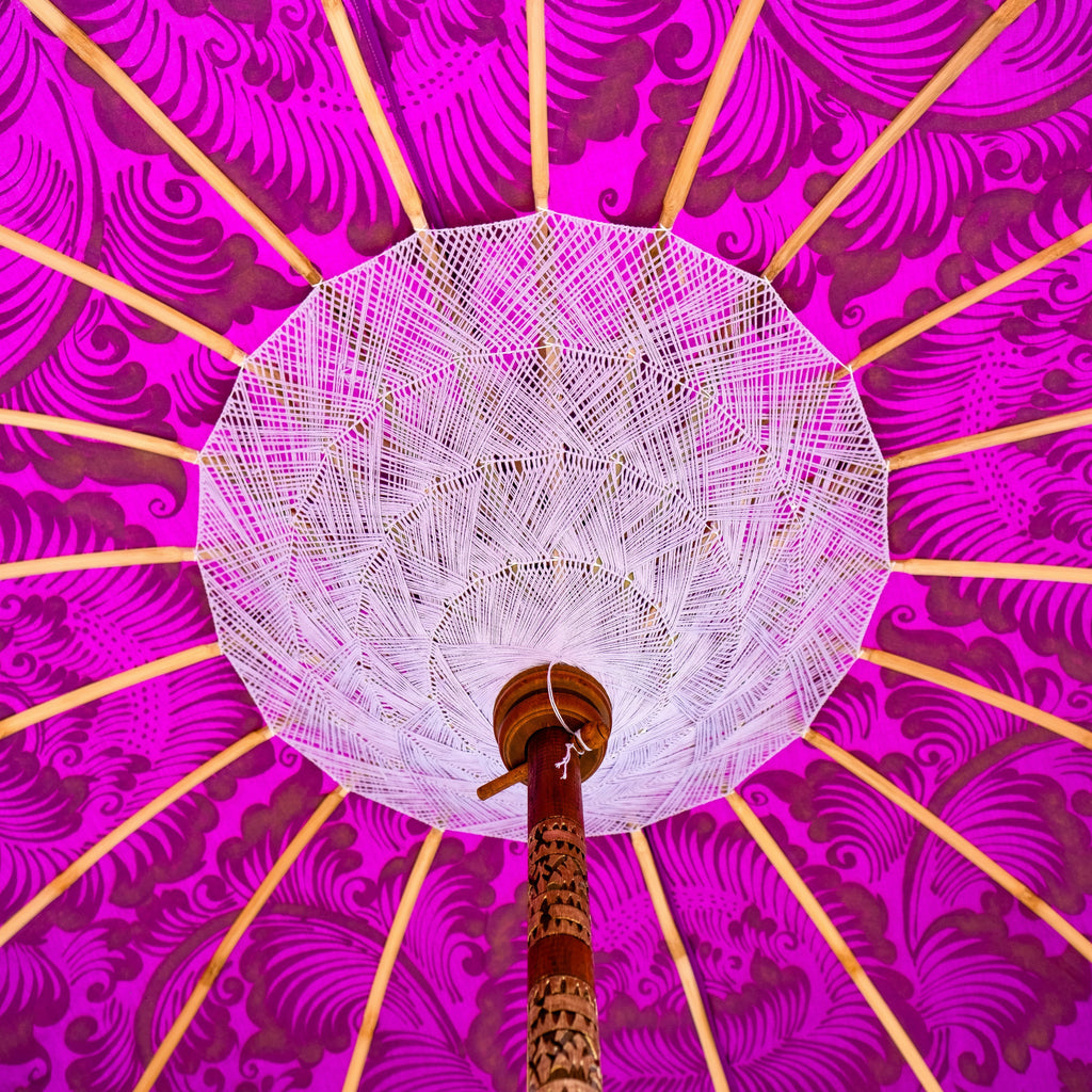 East London Parasol Company Bali Bamboo 2m garden umbrella. purple and gold. Handmade and handpainted with fringing and tassels in shades of white