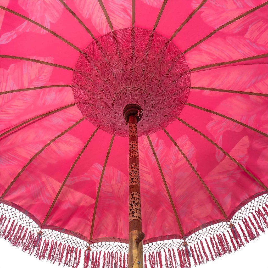 East London Parasol Company Bali Bamboo garden umbrella. Pink Nina, palm print with tassels