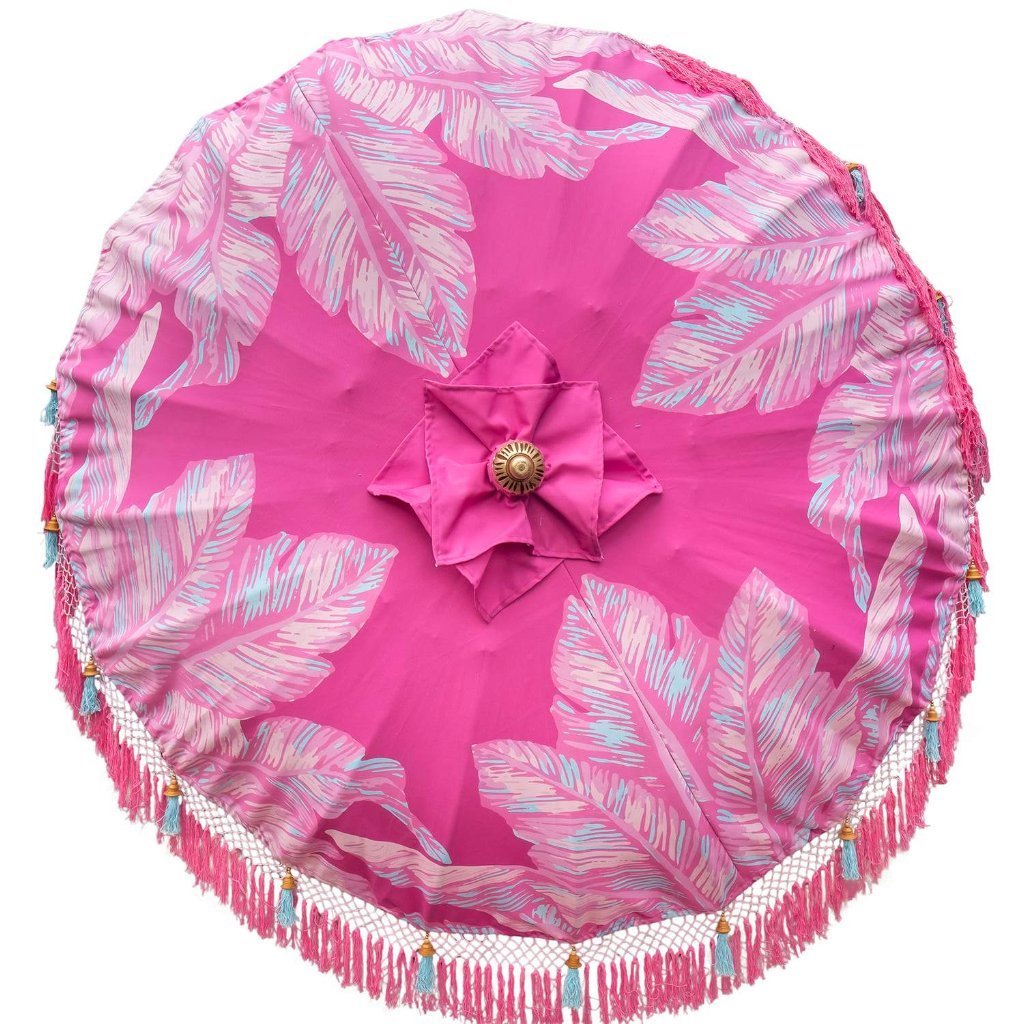 East London Parasol Company Bali Bamboo garden umbrella. Pink Nina, palm print with tassels