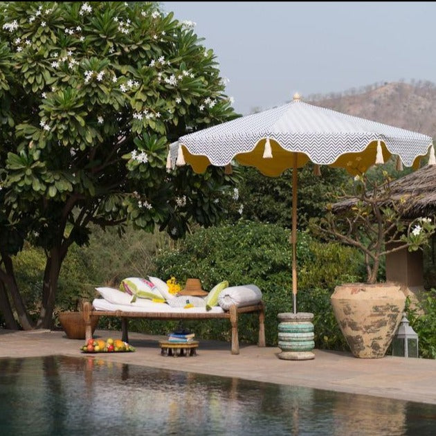 Grey Aretha Octagonal Parasol - Zig Zag pattern lifestyle image of the parasol next to a pool